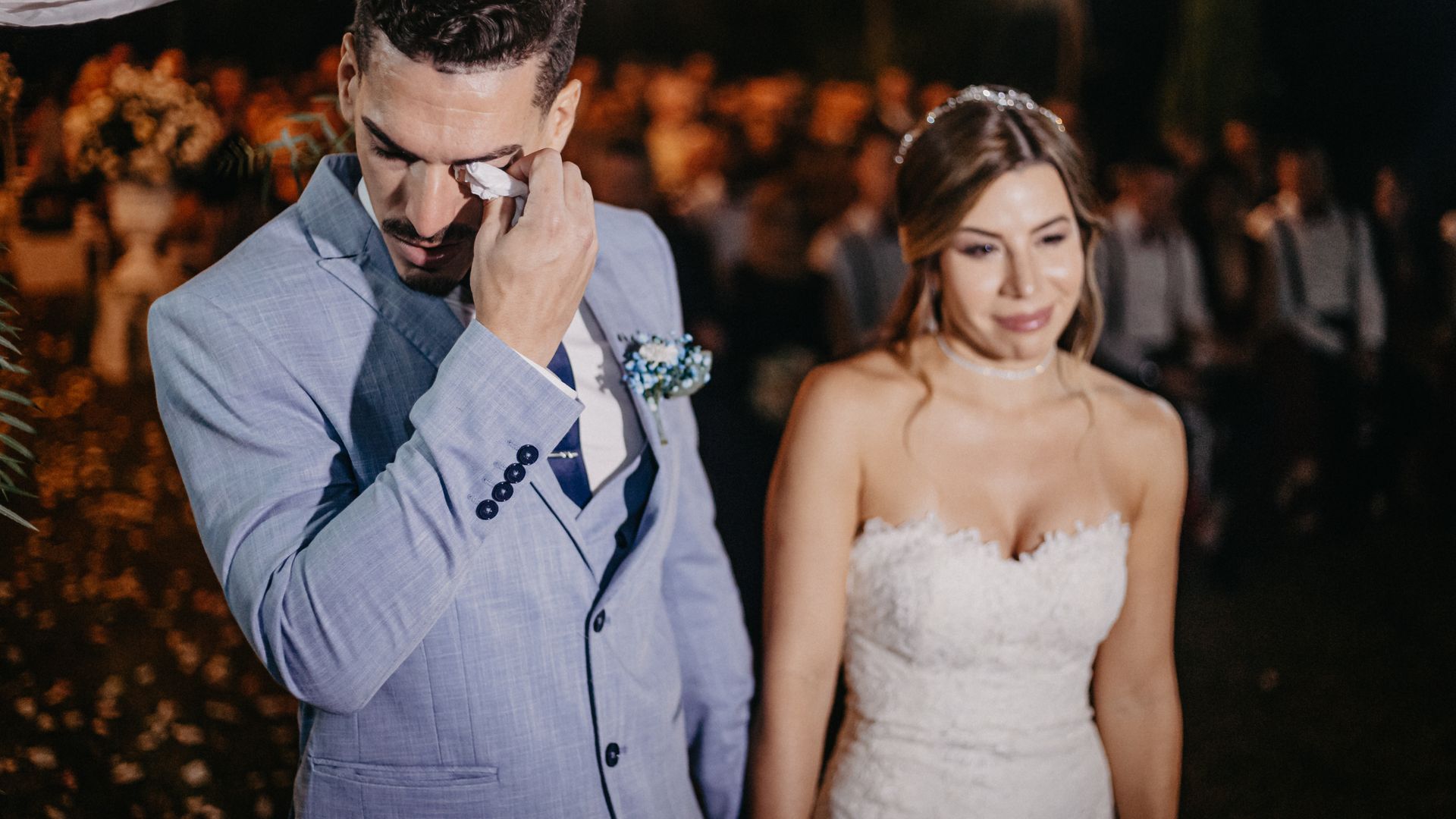 Newlywed couple celebrating with friends and family