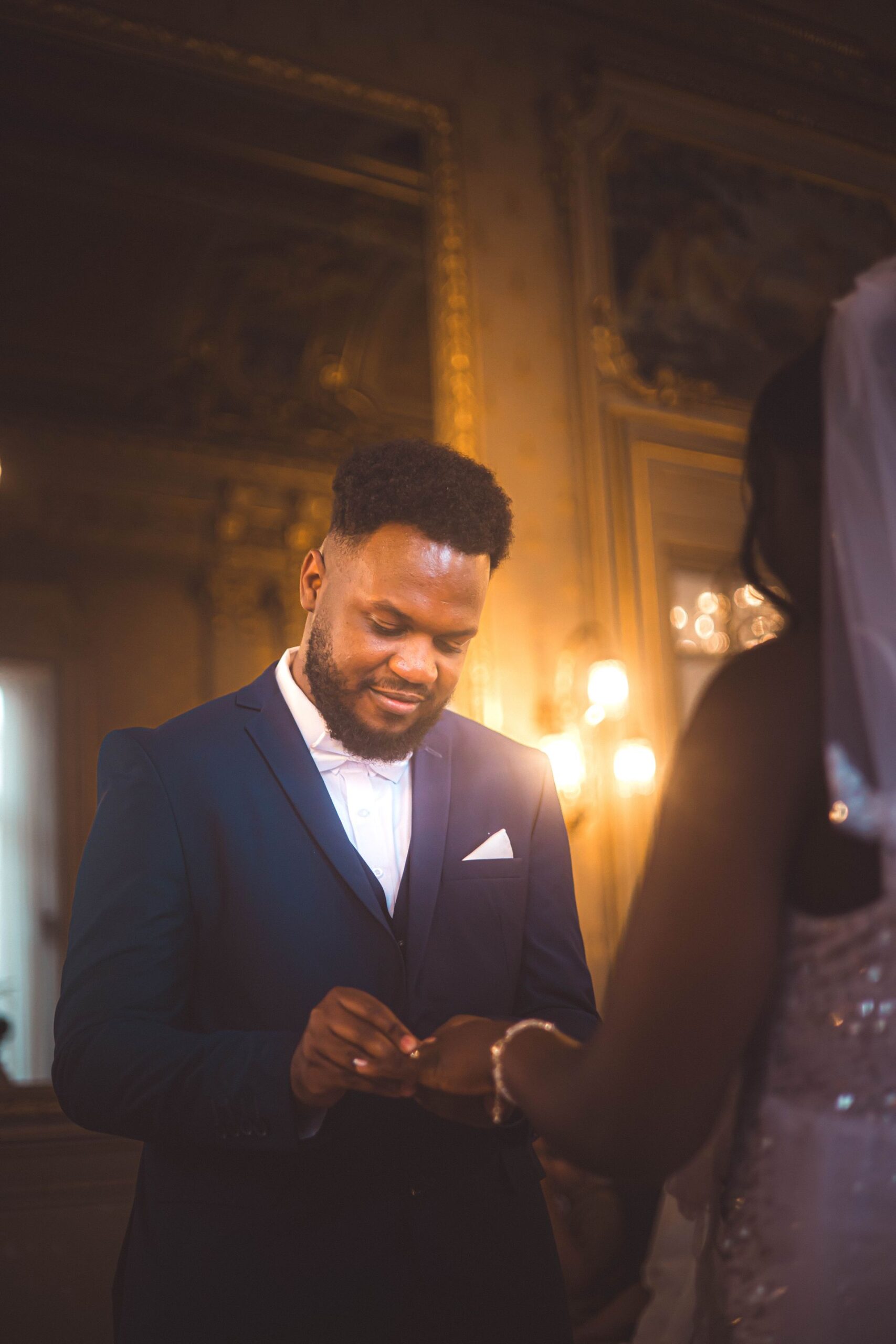 Bride and groom exchanging rings during an elegant wedding ceremony